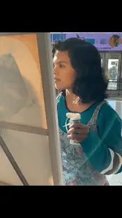 Reshma painting at an SJ Sharks game